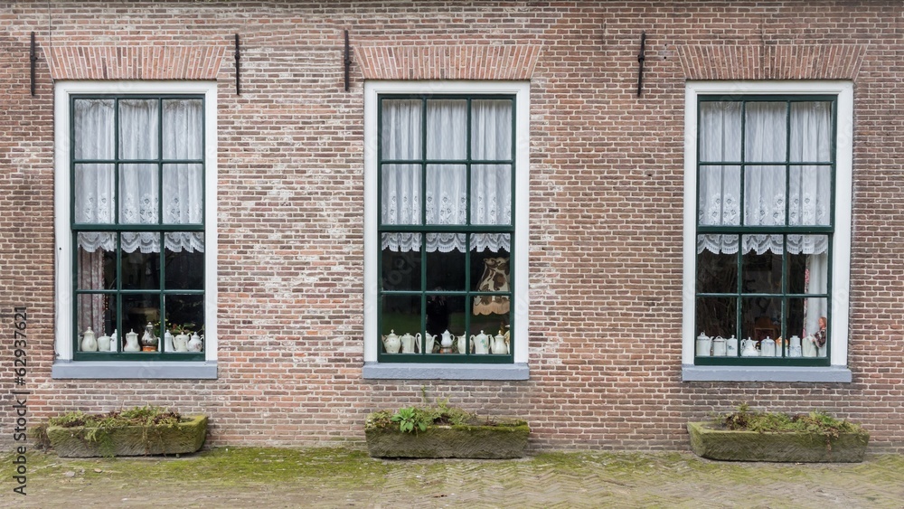 Farm with teapots behind the windows Farm with teapots behind the windows