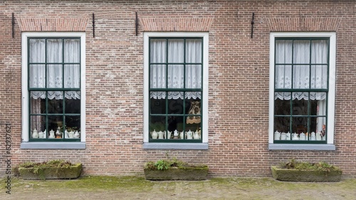 Farm with teapots  behind the windows