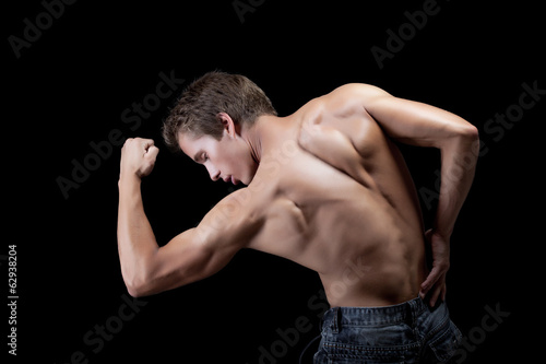 Fotografie, Tablou Image of handsome muscular man showing his biceps