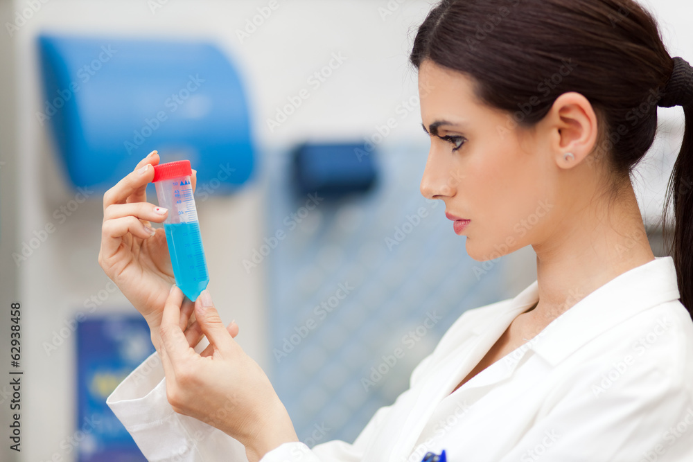 Female scientist doing a test in a laboratory Female scientist doing a test in a laboratory