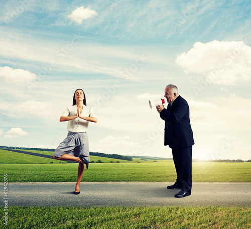 man screaming at calm businesswoman