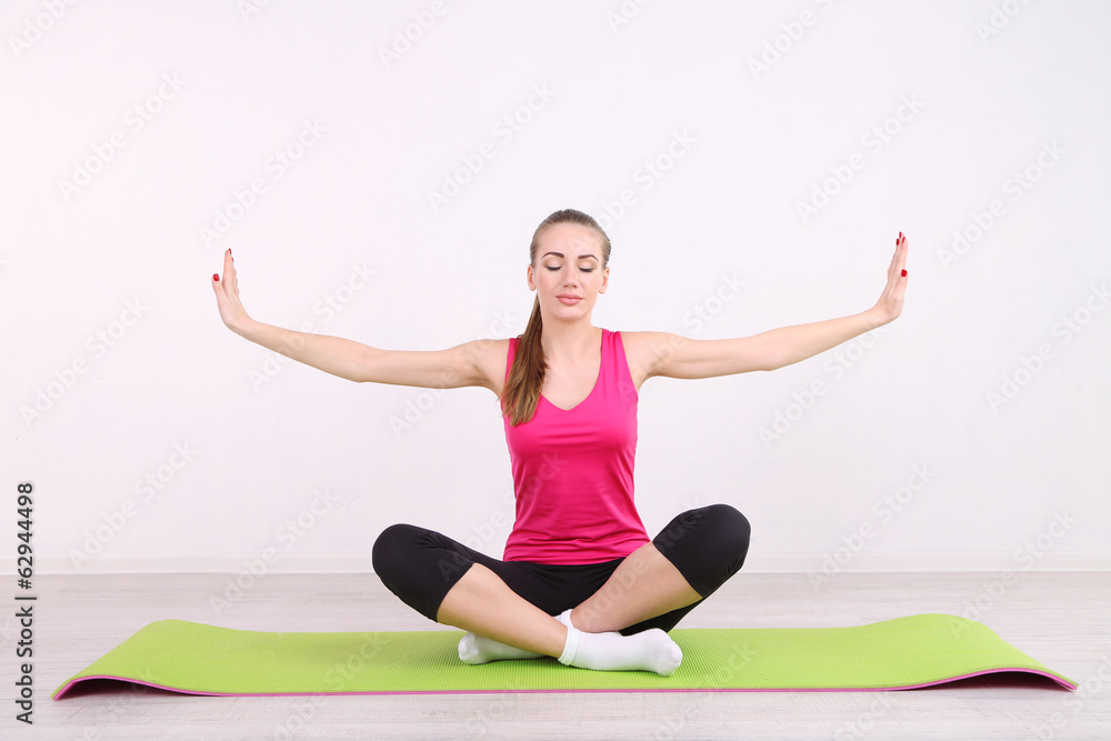 Young beautiful fitness girl exercising in gym Young beautiful fitness girl exercising in gym