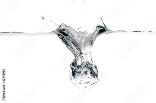 Ice cube splashing into water isolated on white © Africa Studio