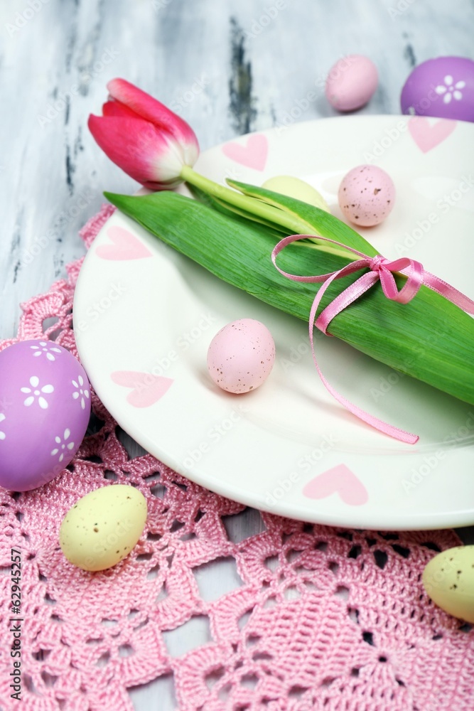 Easter table setting with tulips and eggs Easter table setting with tulips and eggs