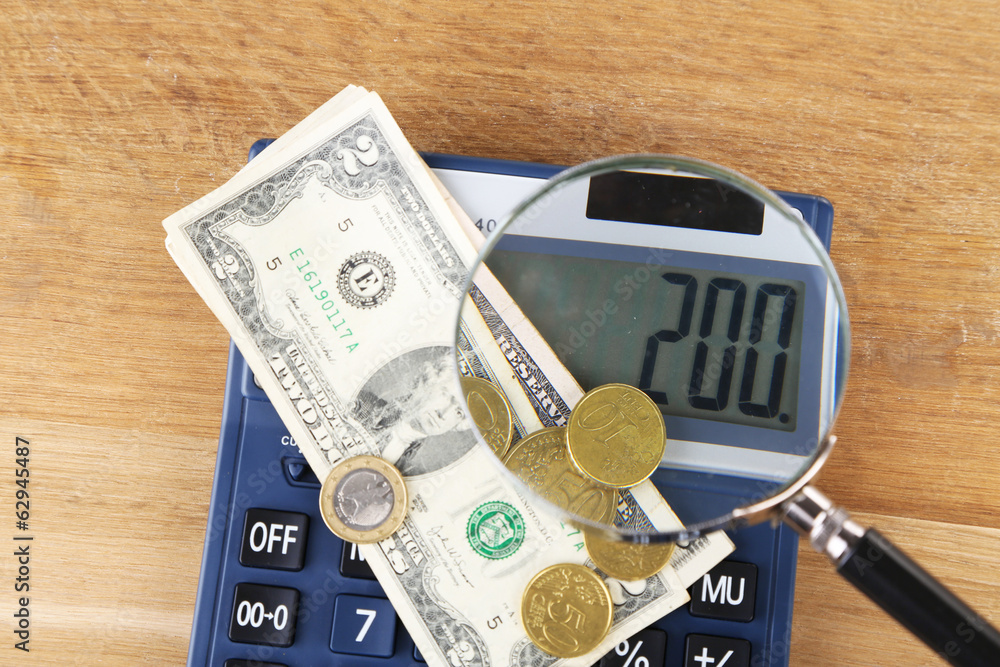 Fraud concept with magnifier and calculator, Fraud concept with magnifier and calculator,