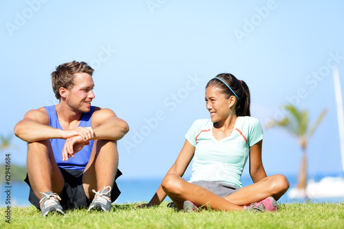 Sport fitness couple relaxing after training