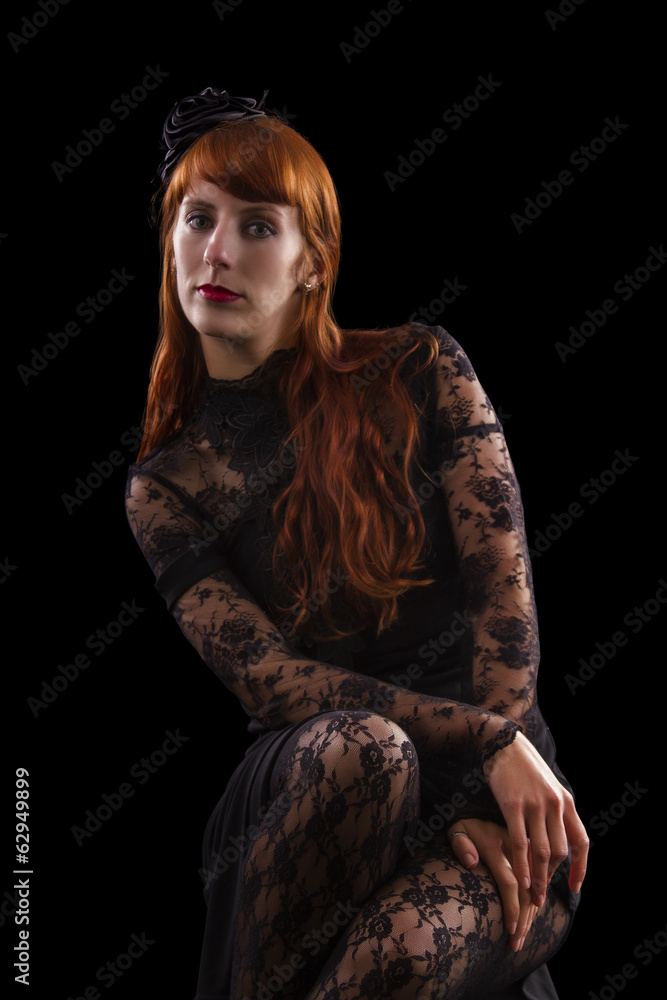 girl on a black gothic dress with red hair 