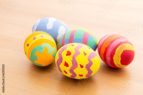 Painted easter egg on wooden table