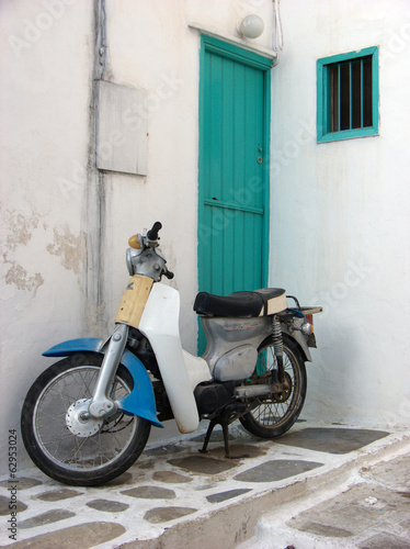 Old Italian Motorbike and Green Wooden Door