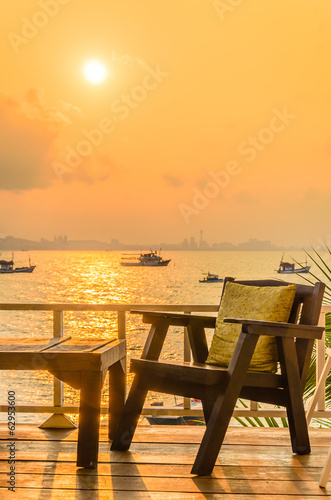 Wood chair sunset on the beach