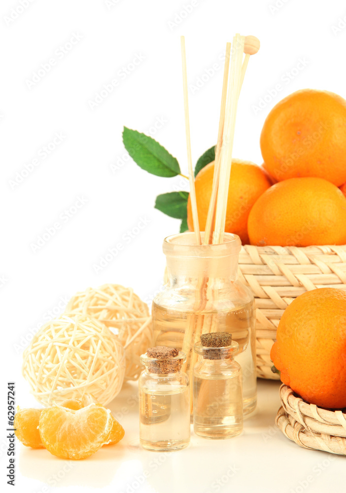 Tangerine essential oil and tangerines, isolated on white Tangerine essential oil and tangerines, isolated on white