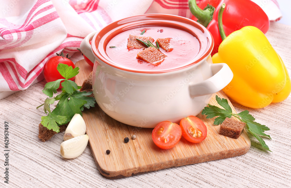 Tasty tomato soup and vegetables, close up Tasty tomato soup and vegetables, close up