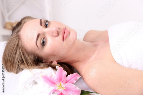 Beautiful young woman having relax in spa salon  close up