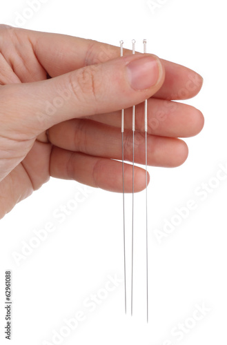 Hand holding needles for acupuncture