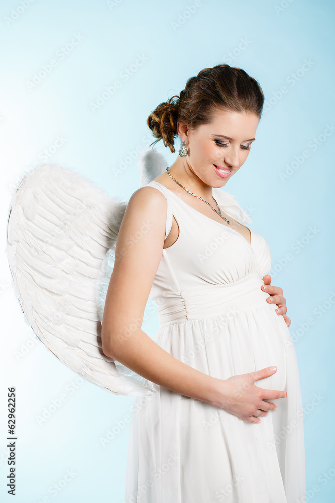 Portrait of a beautiful angelic pregnant woman. Angel Portrait of a beautiful angelic pregnant woman. Angel