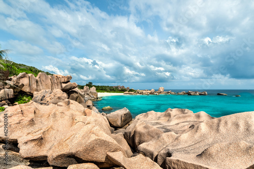 tropical turquoise sea with granite boulders