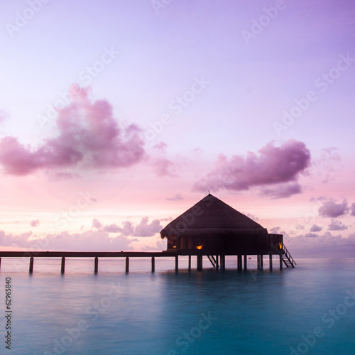 Over water bungalows with steps into amazing green lagoon © fotomaximum