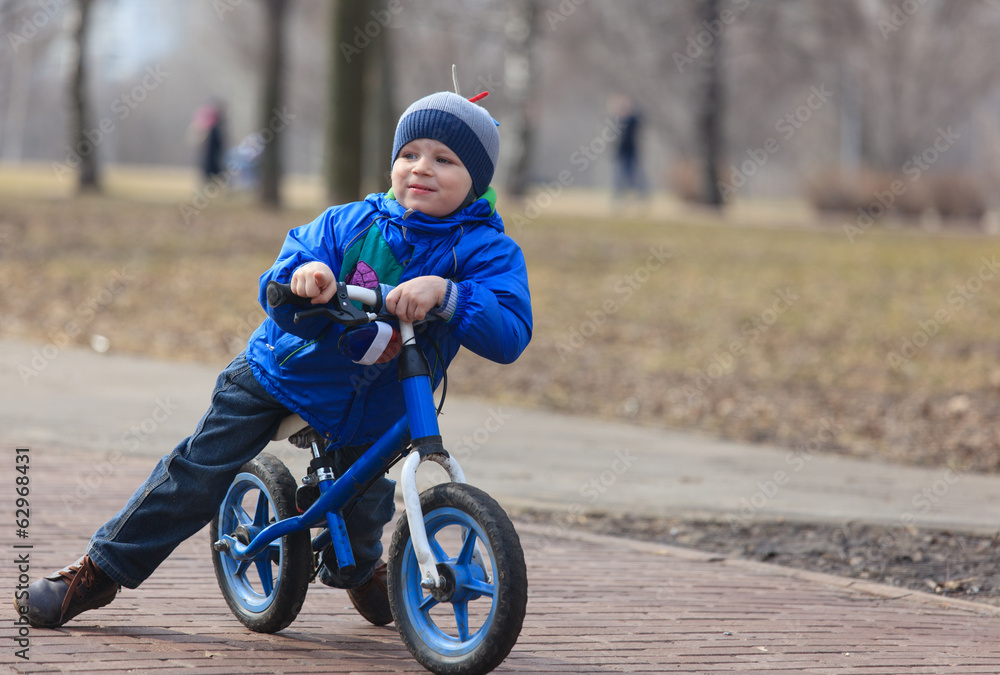 little boy riding runbike, early sport little boy riding runbike, early sport