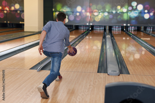 Man during the throwing bowling ball