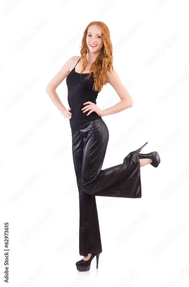 Redhead woman in black bell bottom pants on white Redhead woman in black bell bottom pants on white