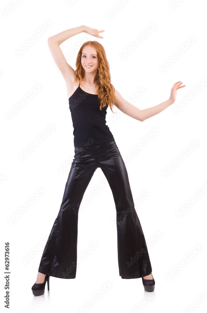 Redhead woman in black bell bottom pants on white Redhead woman in black bell bottom pants on white