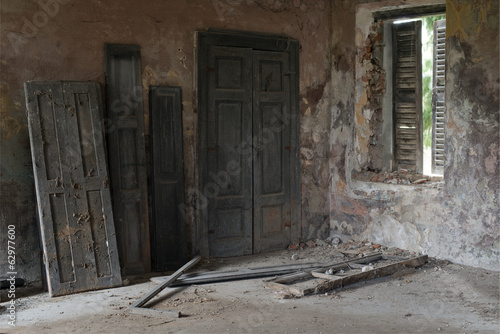 Doors against the wall in abandoned house