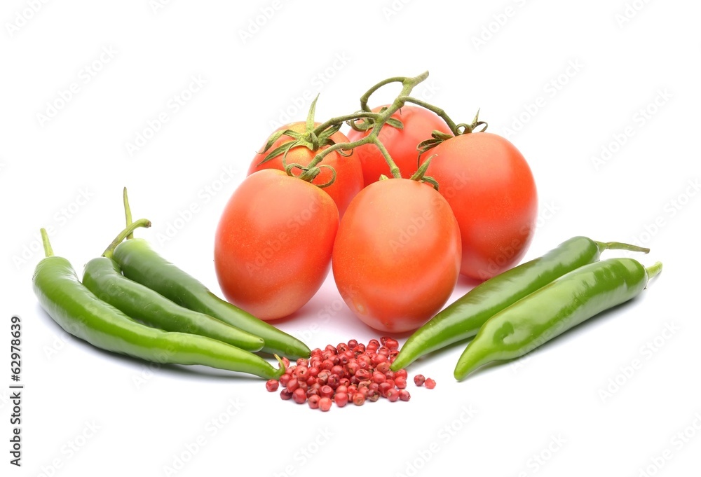 Tomatoes, chilli and cayenne pepper on white background Tomatoes, chilli and cayenne pepper on white background