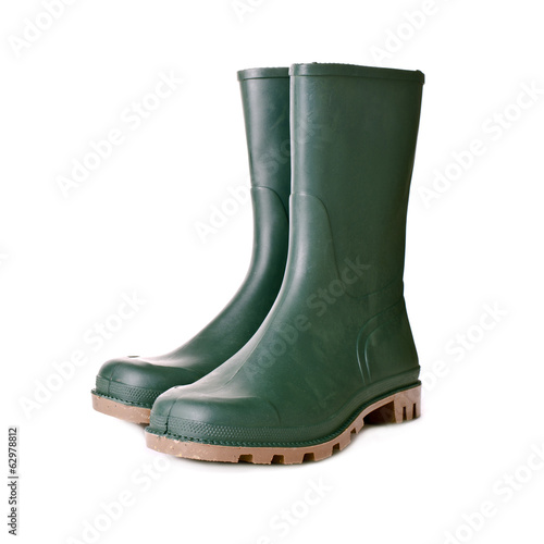 Foto Green rubber boots on white background