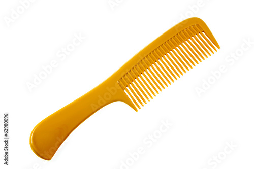 Foto Yellow comb isolated on white background