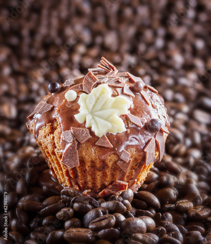 Chocolate muffin with chocolate and coffee beans