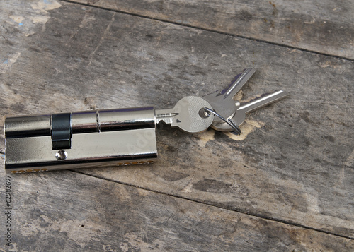 Key cylinder on the wooden table
