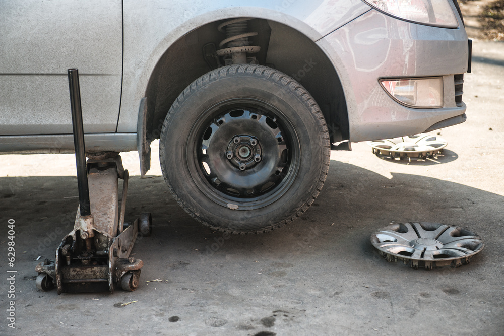 Replacement tires on the car at the service station Replacement tires on the car at the service station