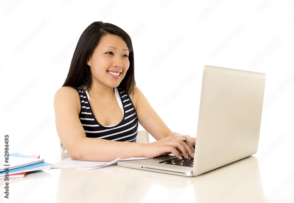 happy chinese asian woman working on her laptop on white backgro happy chinese asian woman working on her laptop on white backgro