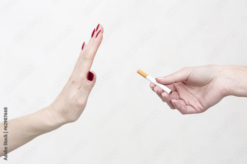 Woman refuses cigarette smoking Woman refuses cigarette smoking
