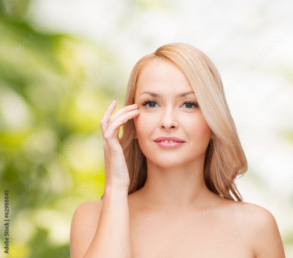 beautiful woman touching her eye area beautiful woman touching her eye area