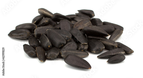 Fotografie Sunflower seeds isolated on white background