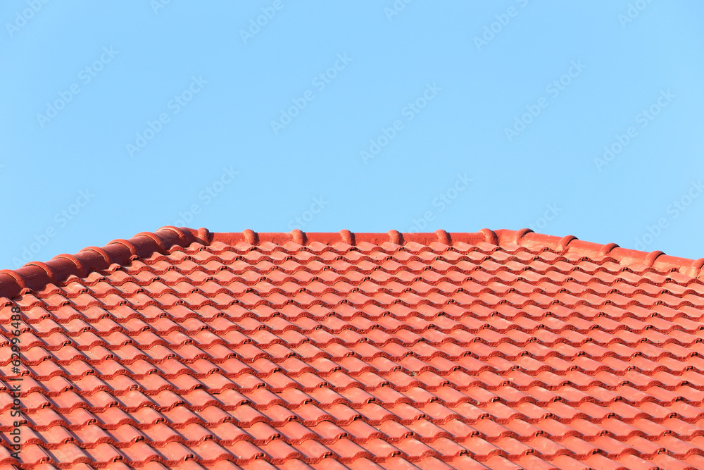 roof under construction with stacks of roof tiles for home build roof under construction with stacks of roof tiles for home build