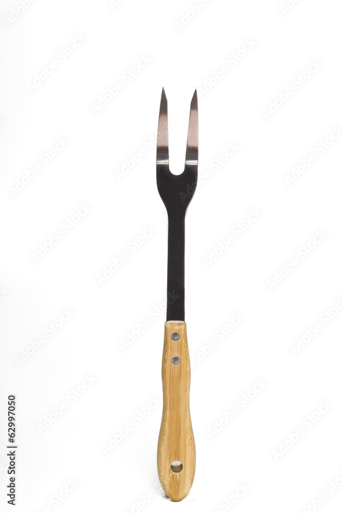 Close up view of a grill fork isolated on a white background. Close up view of a grill fork isolated on a white background.
