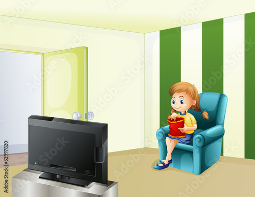 A girl watching TV while eating