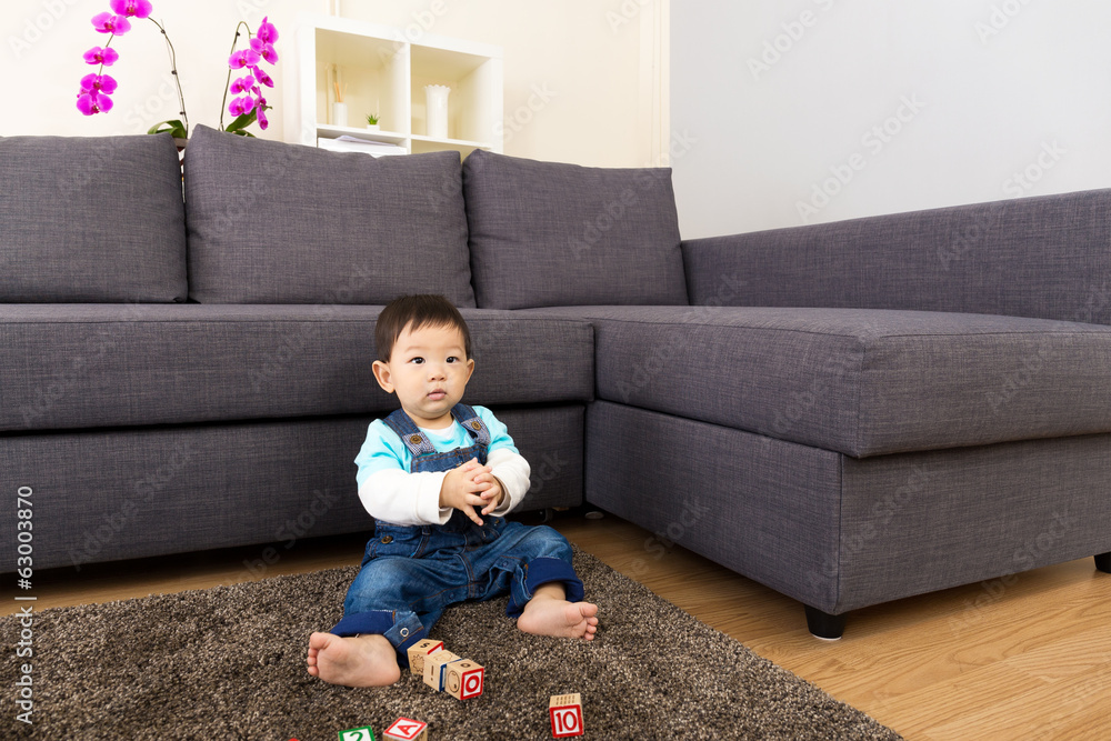 Asian baby boy playing toy block at home Asian baby boy playing toy block at home