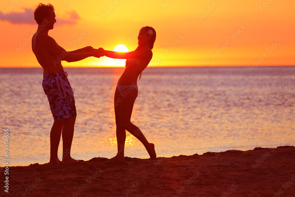 Romantic couple fun on beach sunset during travel