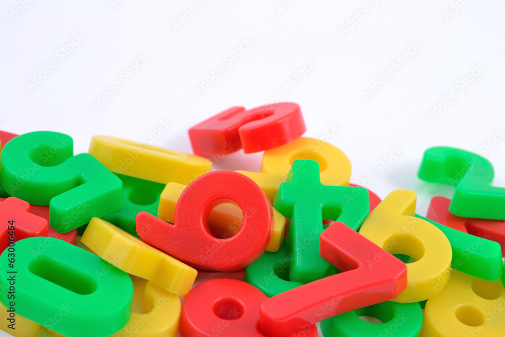 Colorful plastic numbers on white Colorful plastic numbers on white