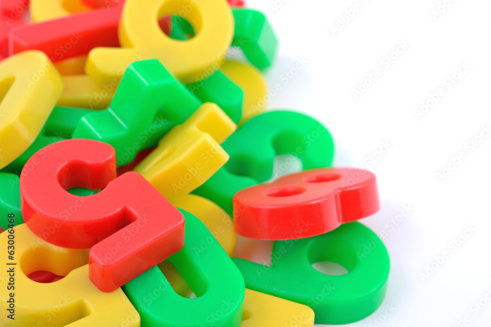 Colorful plastic numbers on white Colorful plastic numbers on white