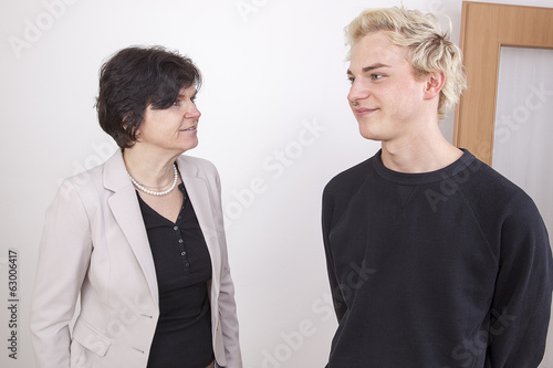 Business Woman and Young Man converse photo