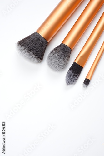 cosmetic brushes on white background
