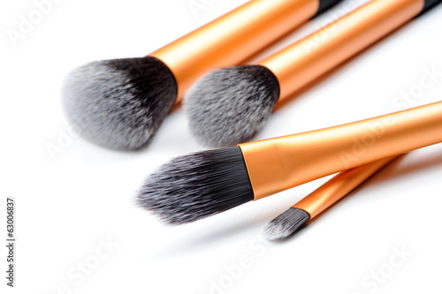cosmetic brushes on white background