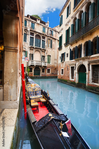 Gondola embanked on canal photo