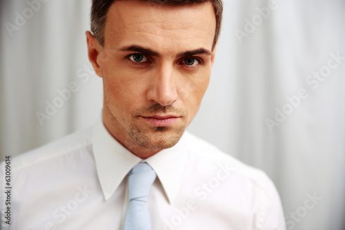 Portrait of a confident businessman in white shirt