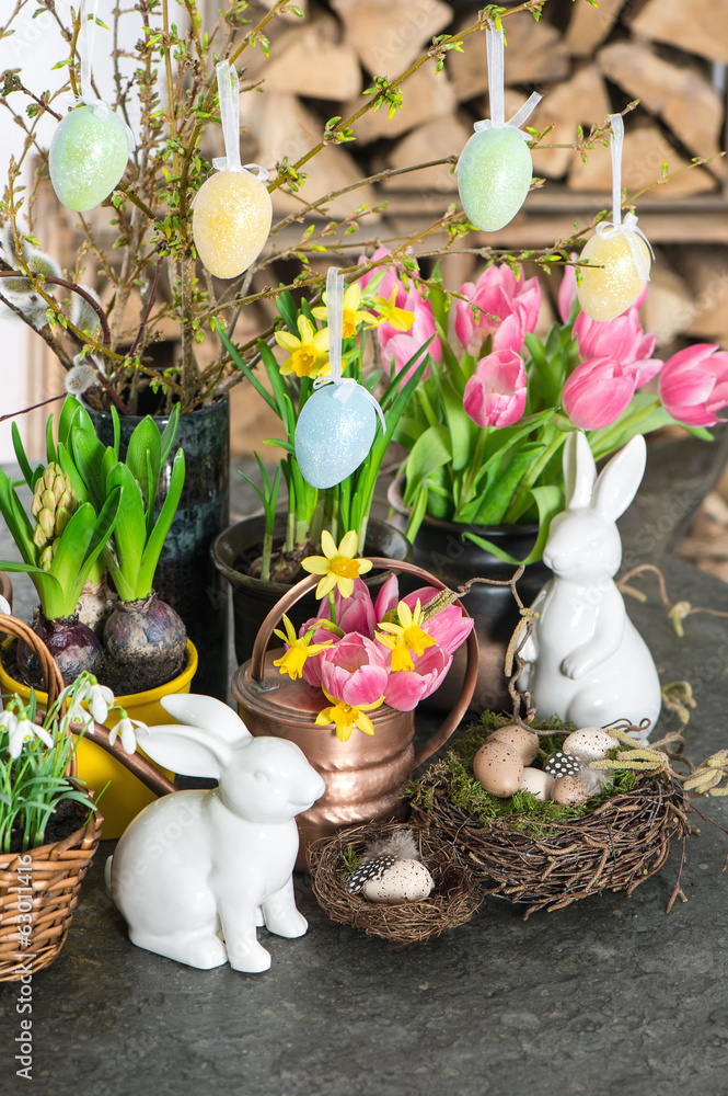 Fototapeta premium spring flowers with easter bunny and eggs decoration