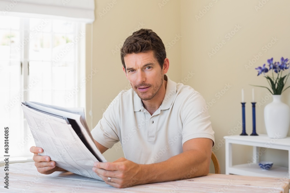 Portrait of a man reading newspaper